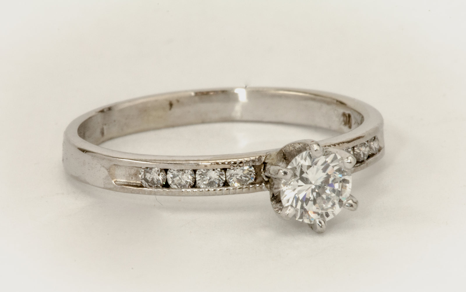 A .41ct Diamond With 1/4ct Channel Set White gold Ring