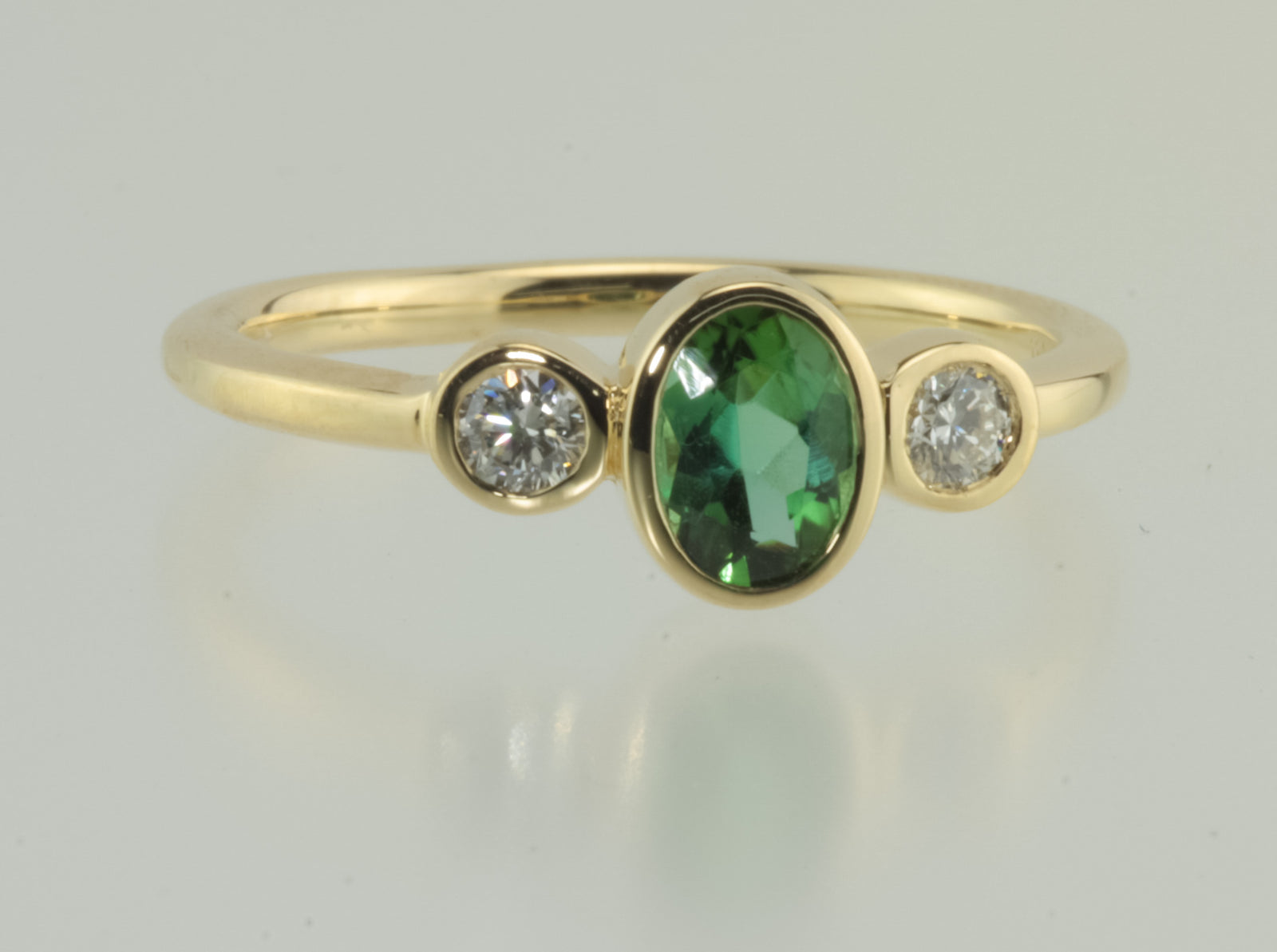 Green Tourmaline and Diamond Bezel Set 18kt Yellow gold ring