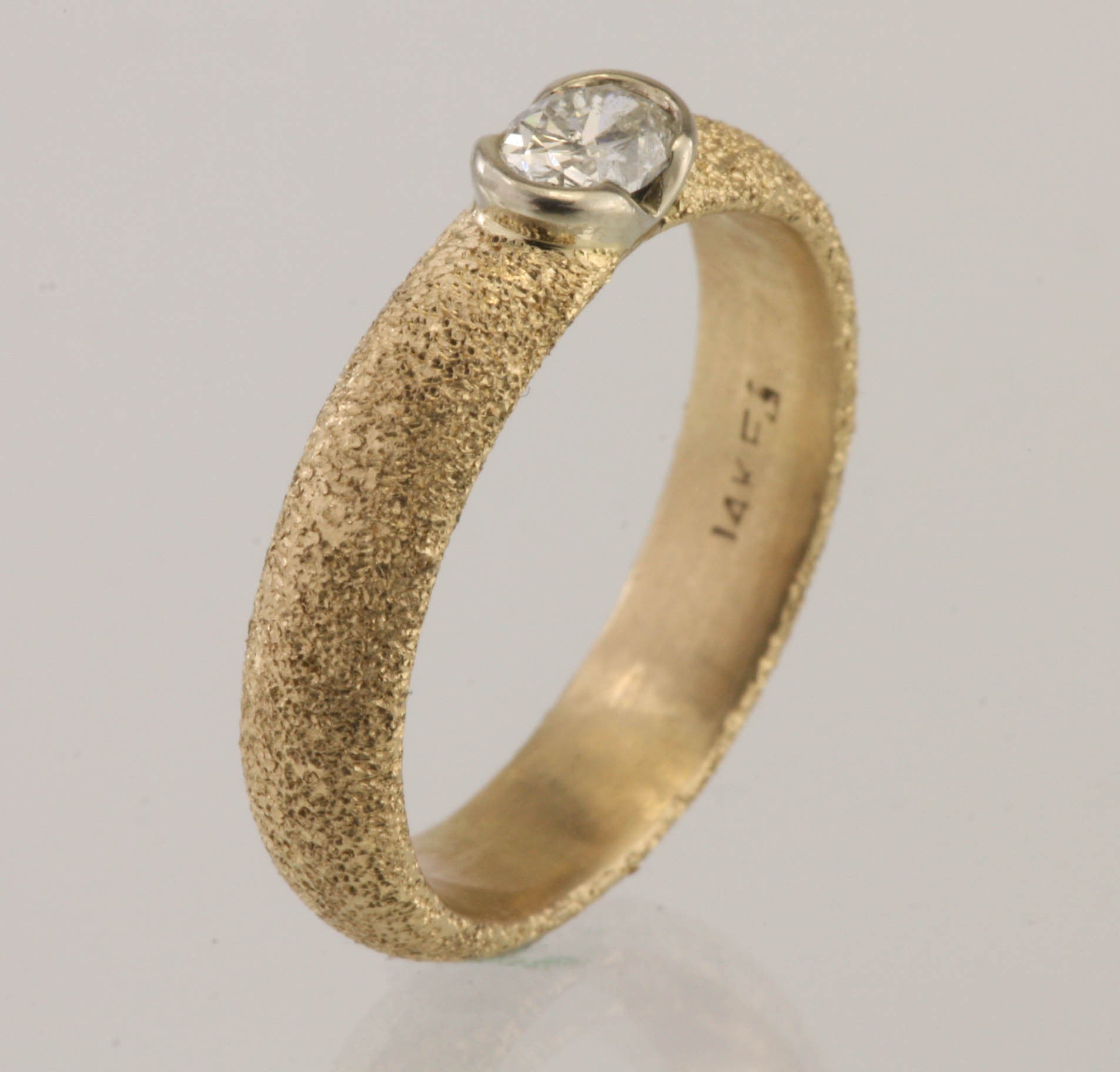 Oval Diamond In 14kt Partial Bezel Ring