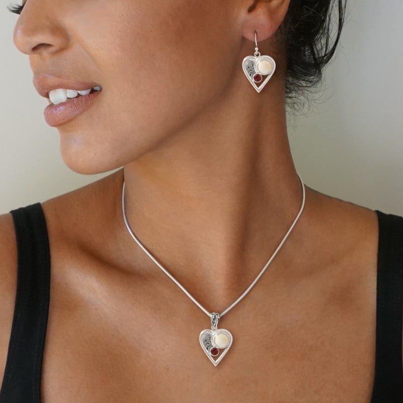 "Heartbeat" Fossilized Mammoth Ivory Garnet and Sterling Silver Pendant