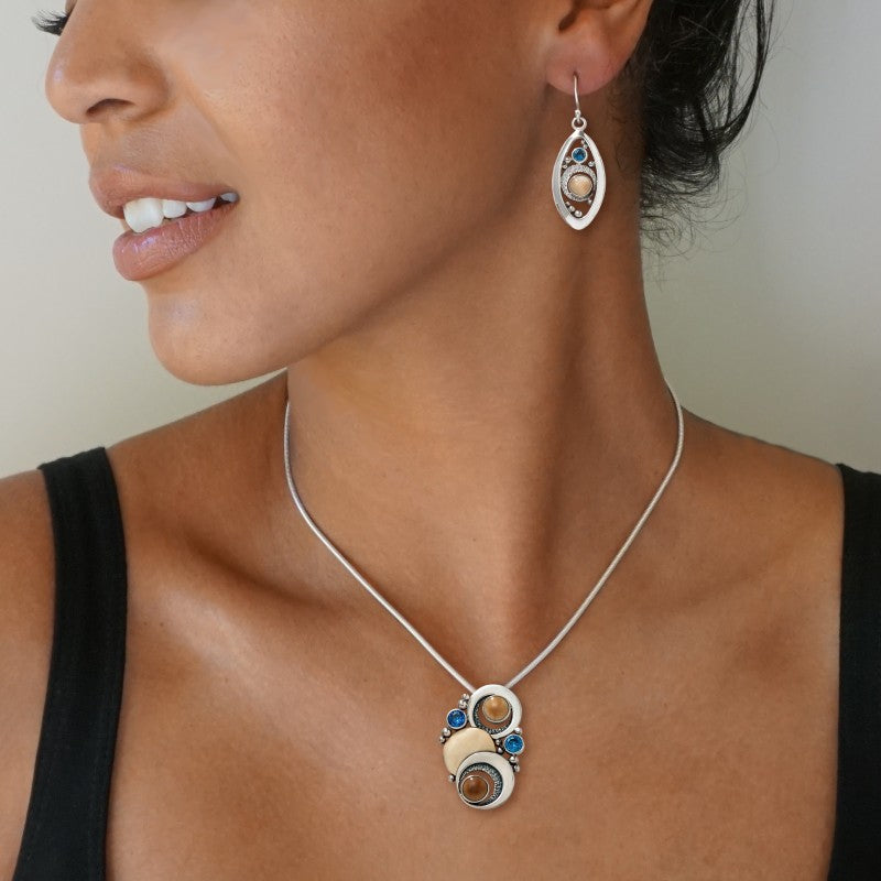 FOSSILIZED WALRUS IVORY AND BLUE TOPAZ SILVER MOON NECKLACE – DOUBLE ECLIPSE